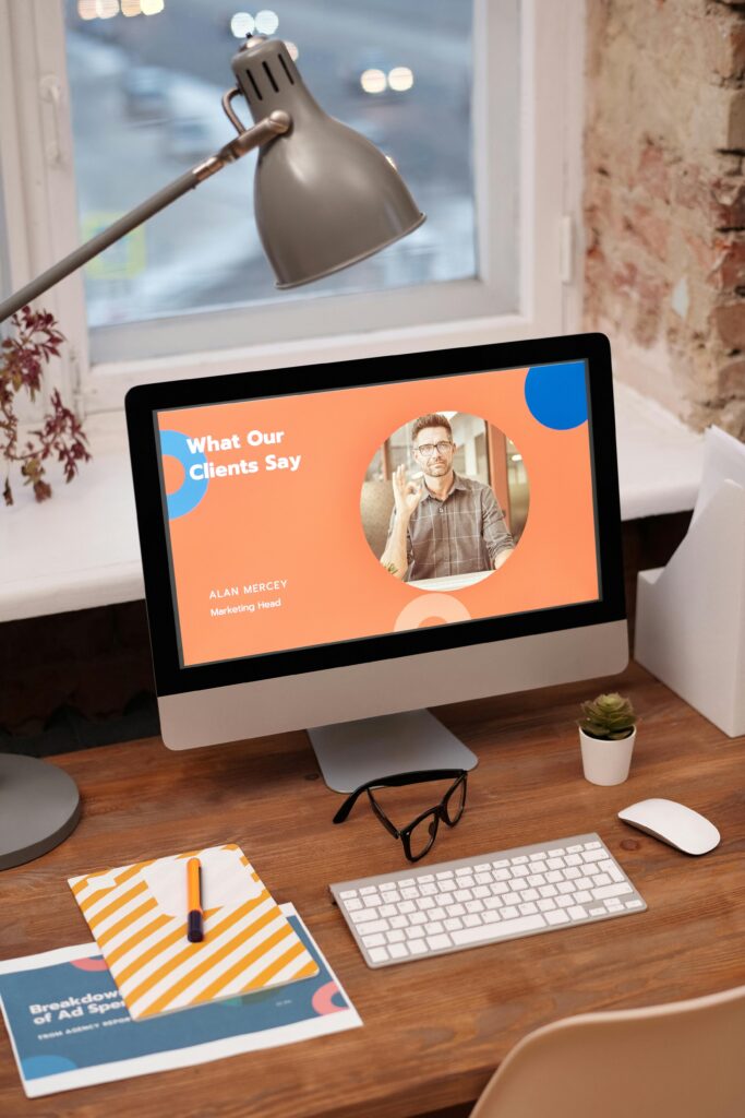 Web Development & Hosting 2 Stylish home office setup with computer showcasing client testimonials.